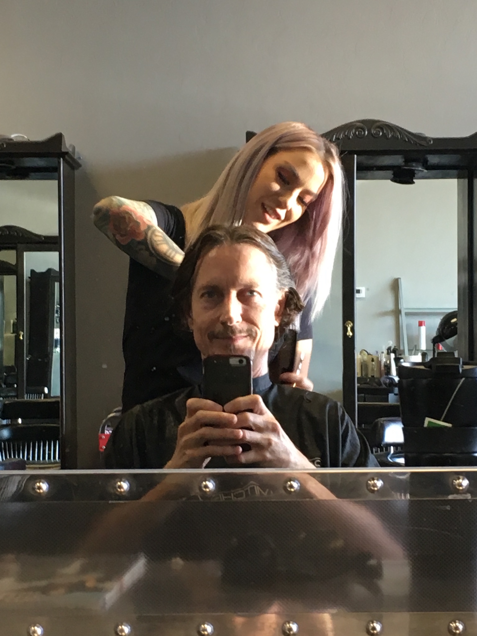 Allan Sturm getting his haircut by Alexis Nicole in Tucson Arizona